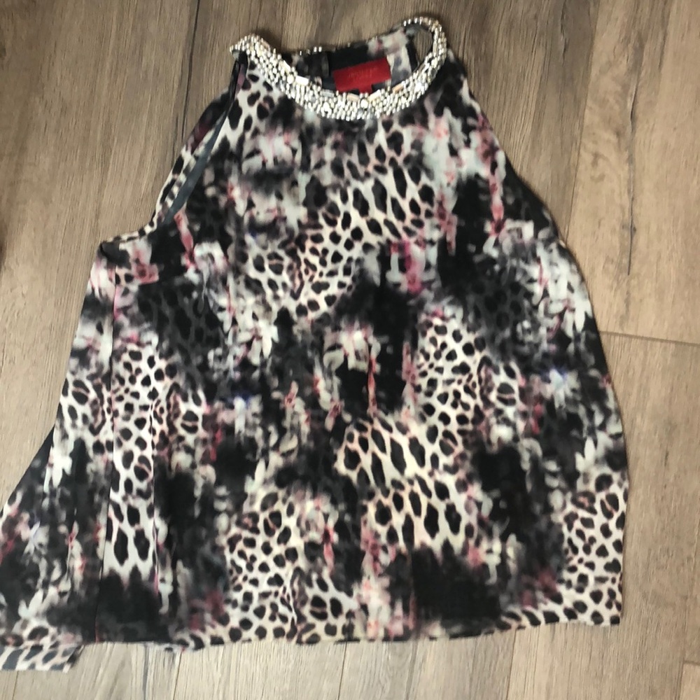 Jennifer López flowy open back studded cami